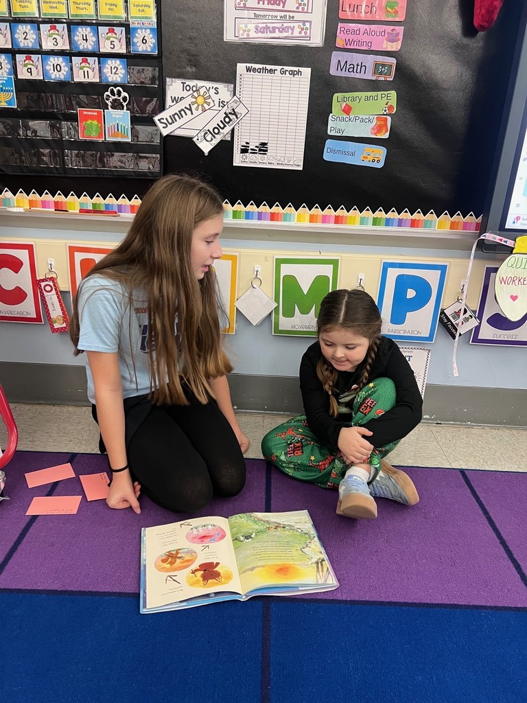 two students reading together