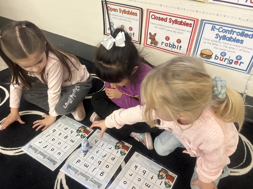 students working together with letters