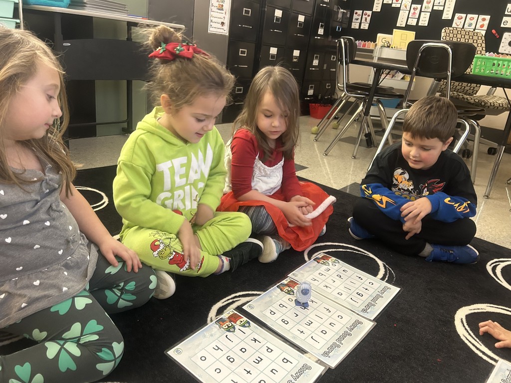 students working together with letters