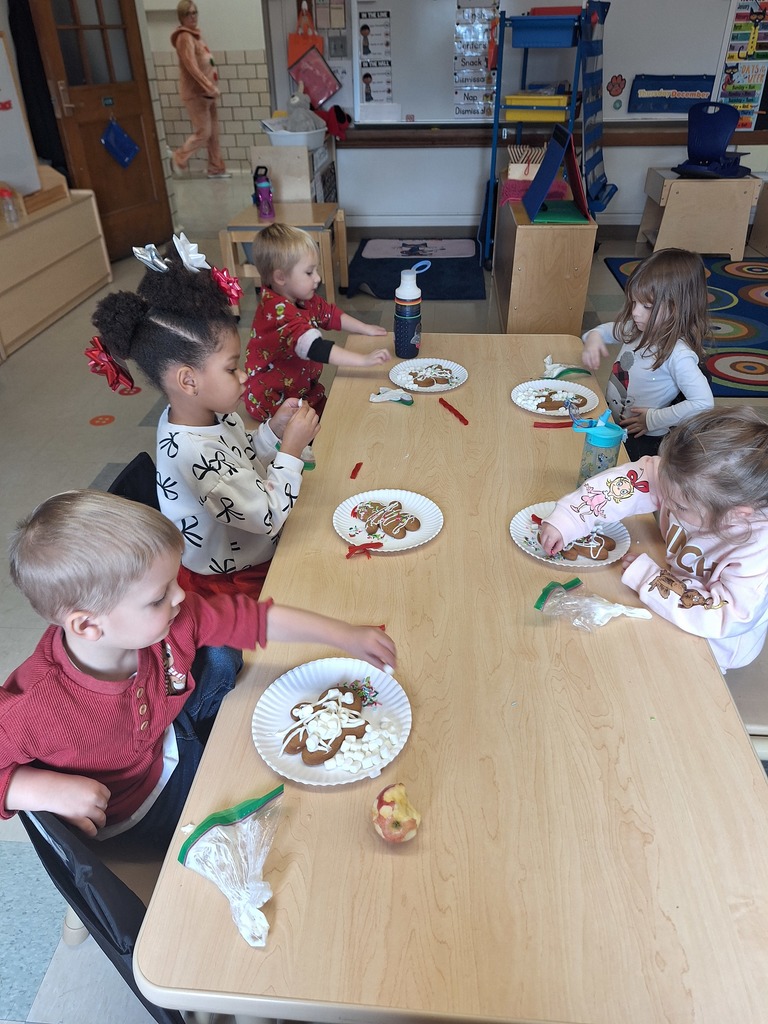 students decorating gingerbread cookies