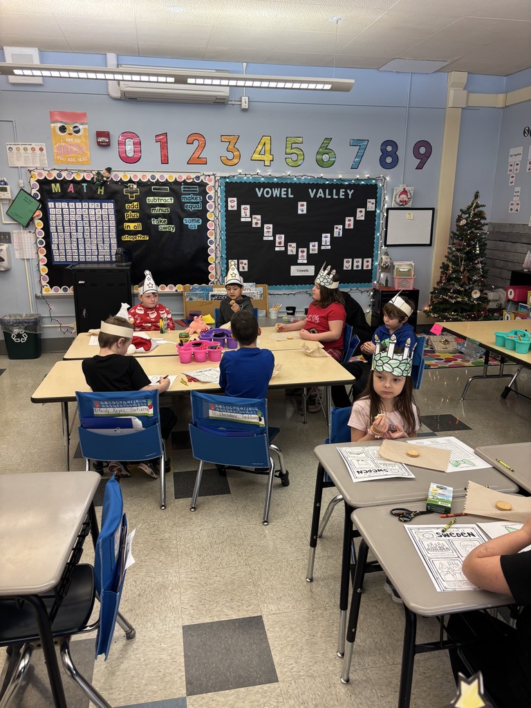 students working at tables in classroom