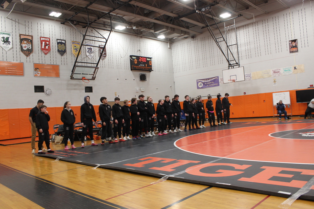 wrestling team standing in gym