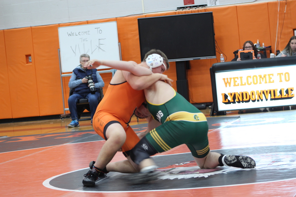 two boys wrestling in gym