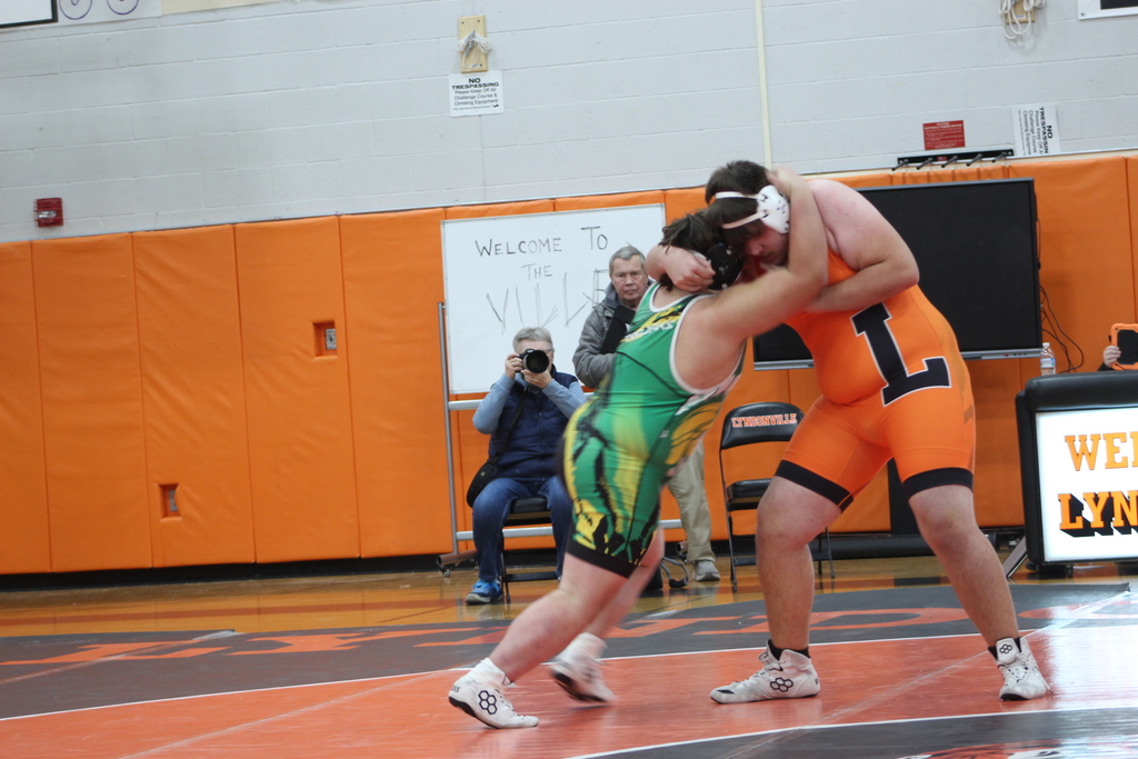 two boys wrestling in gym