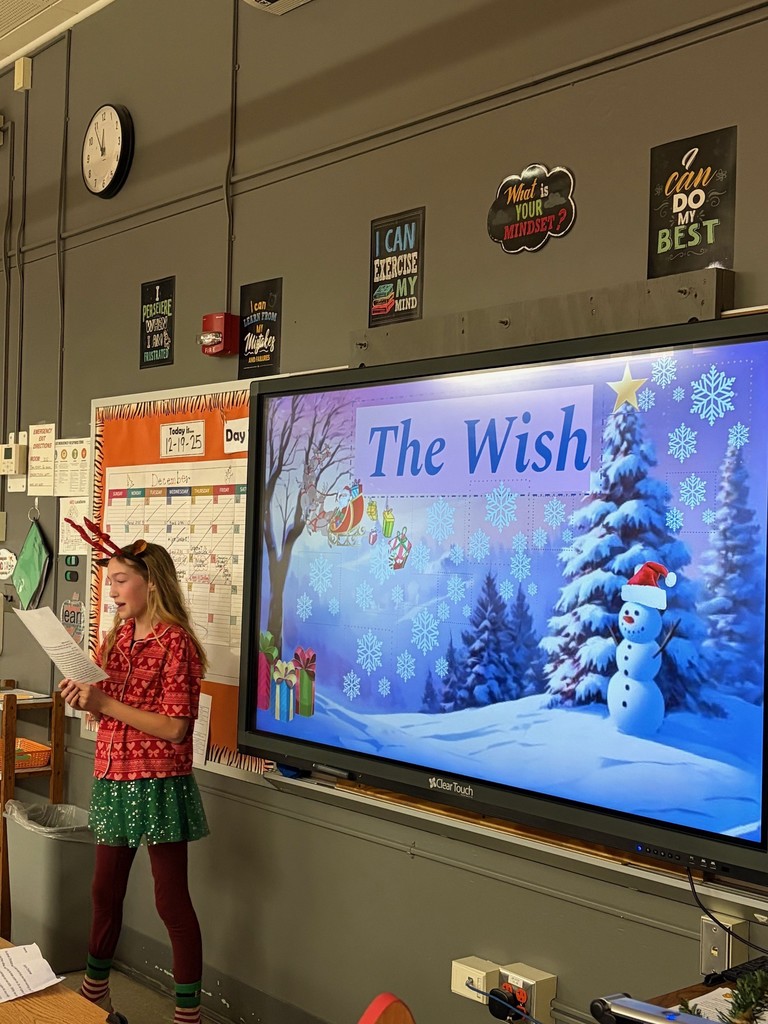 girl speaking in front of smartboard