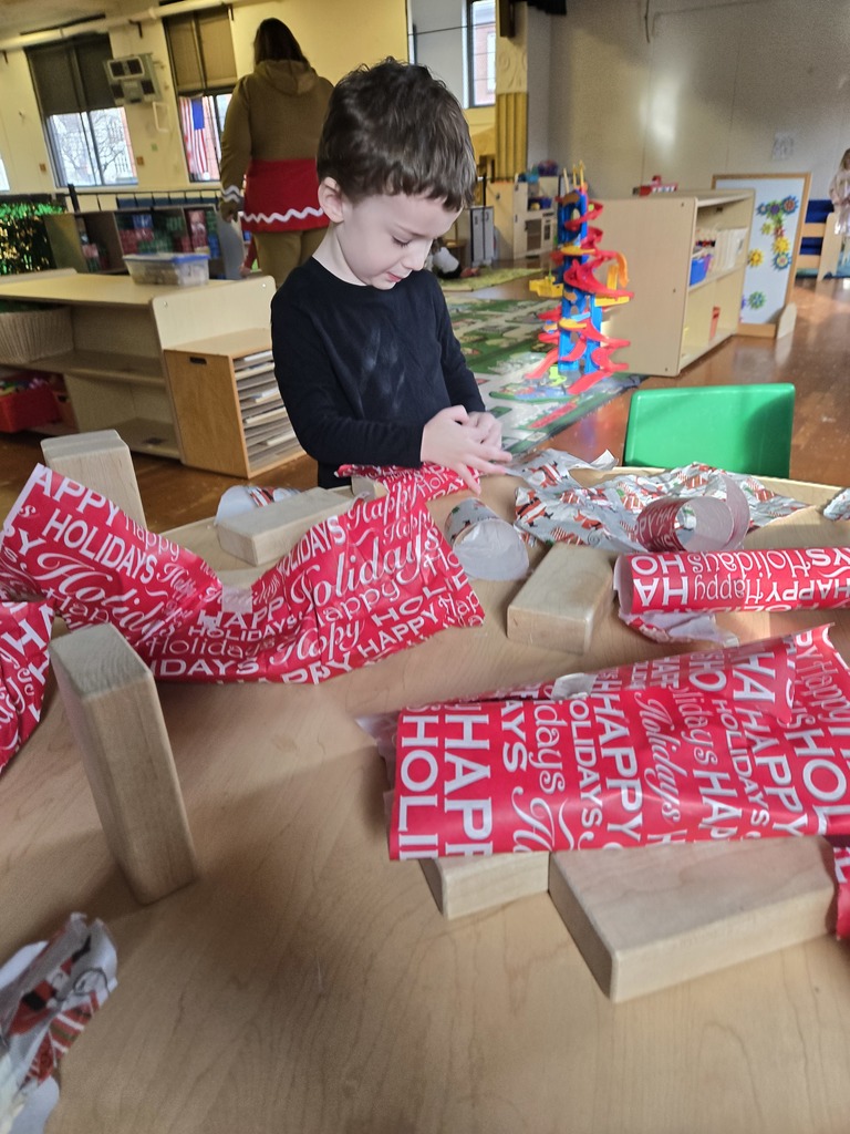 boy wrapping a gift