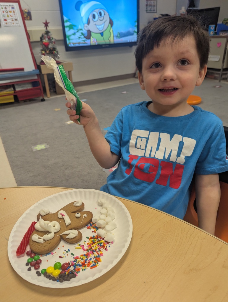 a student decorating their gingerbread cookie