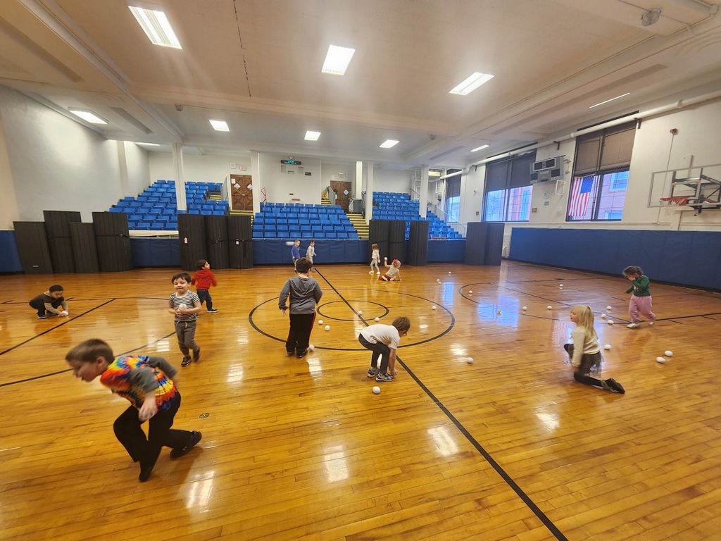 students runnig around the gym