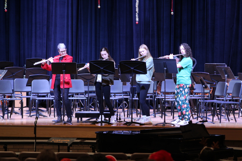 students playing flutes with band teacher