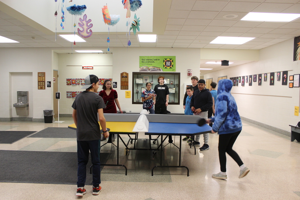 student playing ping pong