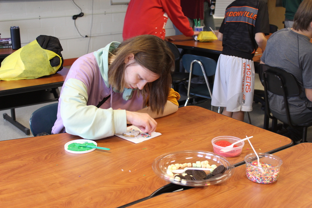 student decorating a cookie