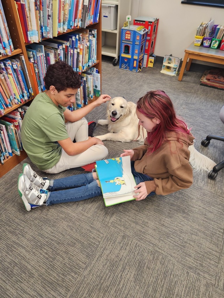 two students in library with dog