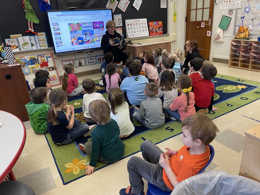 students listening to teacher in classroom