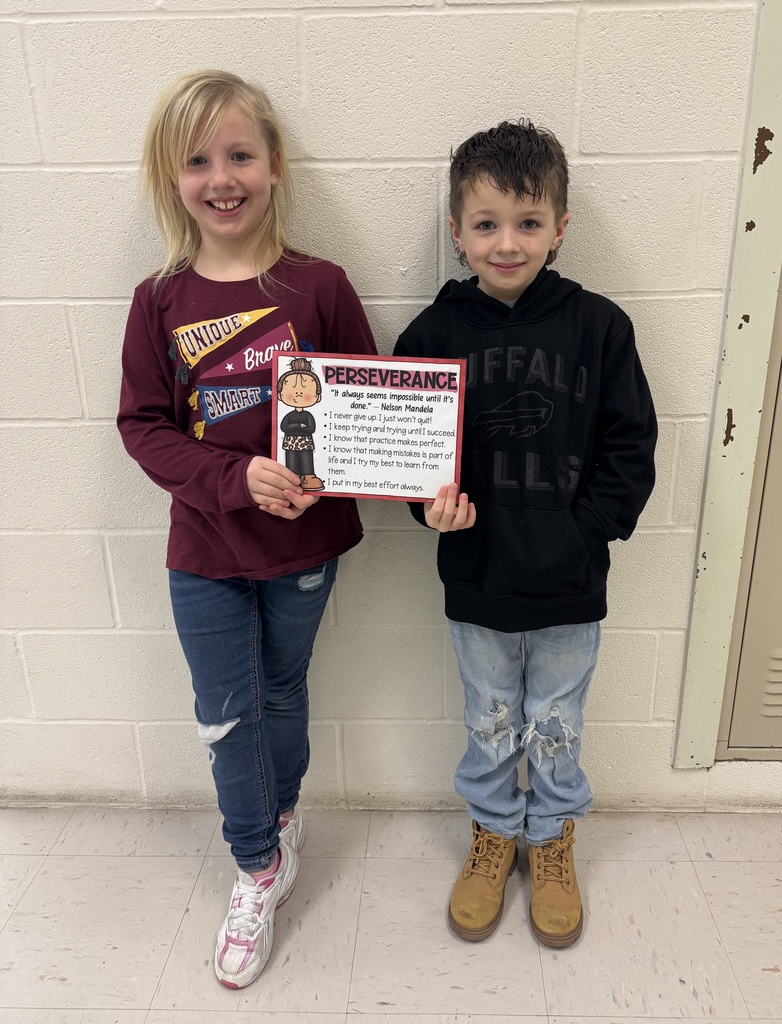 two students holding certificate