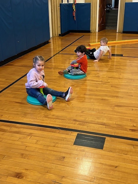 students sitting on sit and spins
