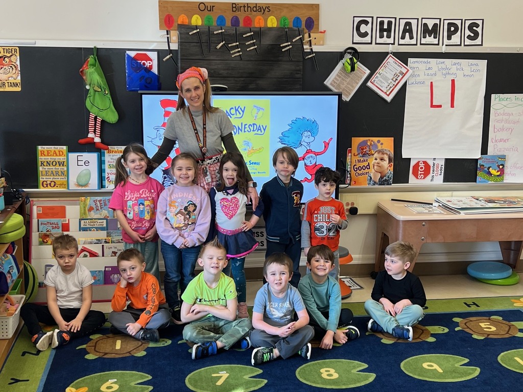 students in classroom with their teacher
