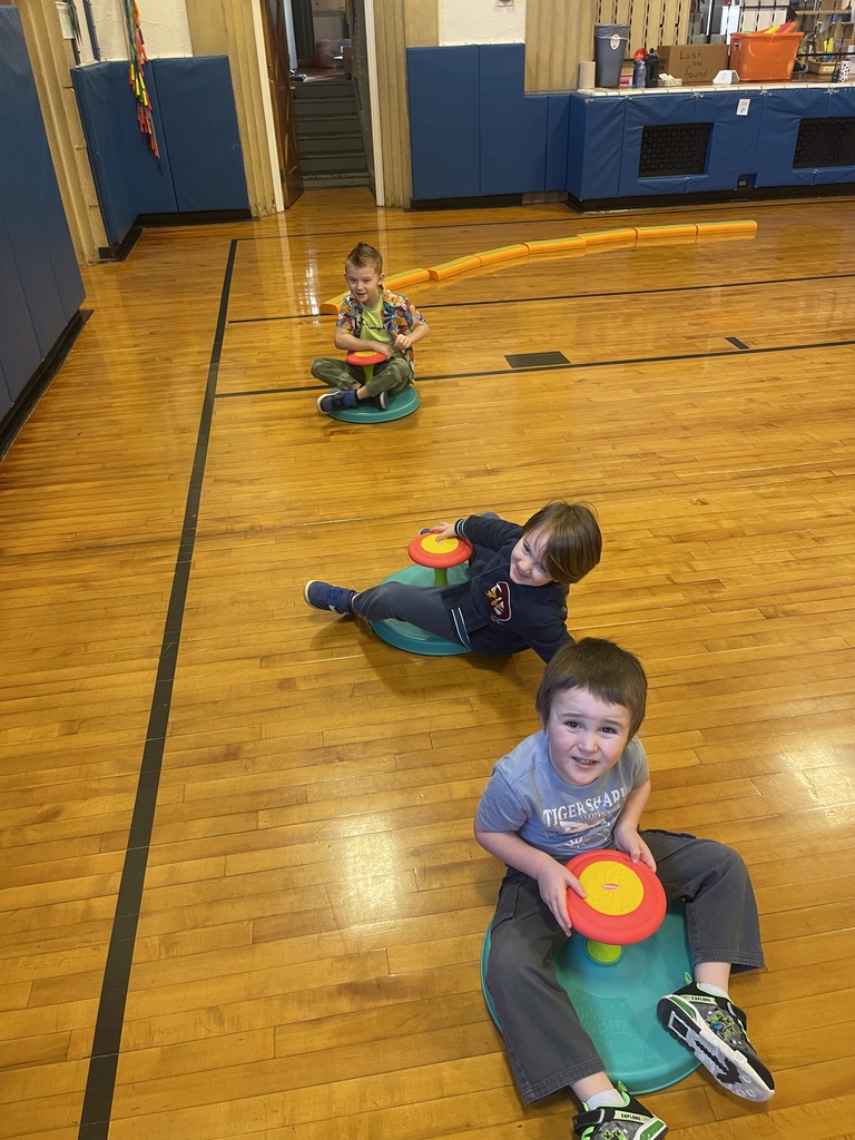 students sitting on sit and spins