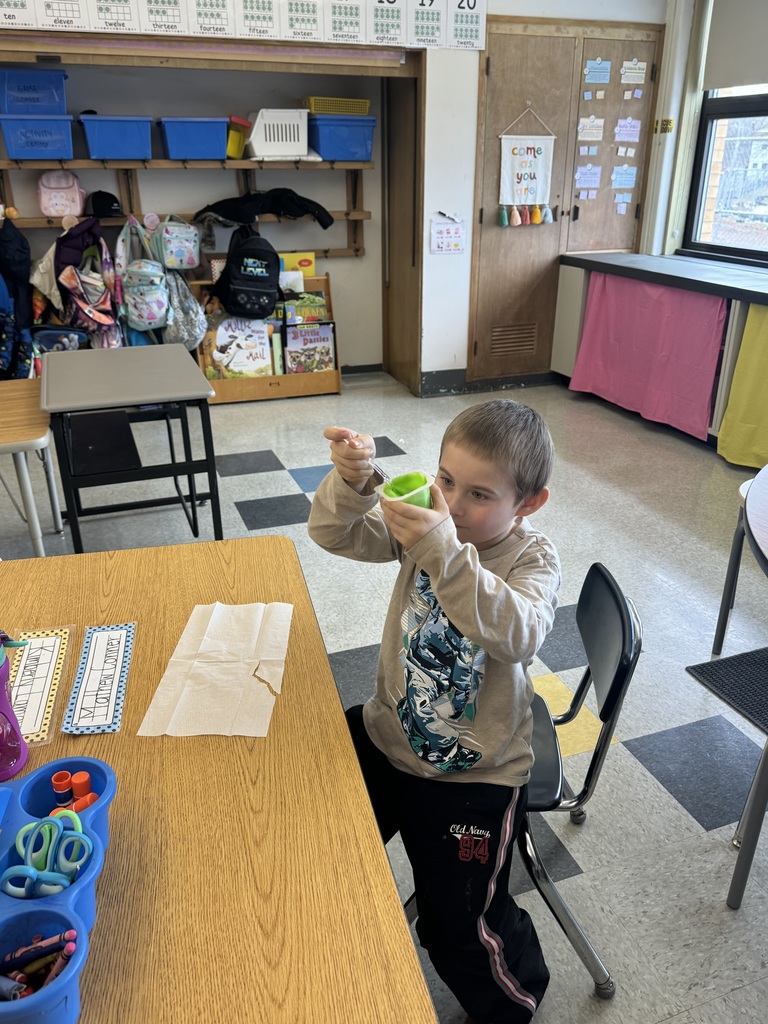 boy holding up snack