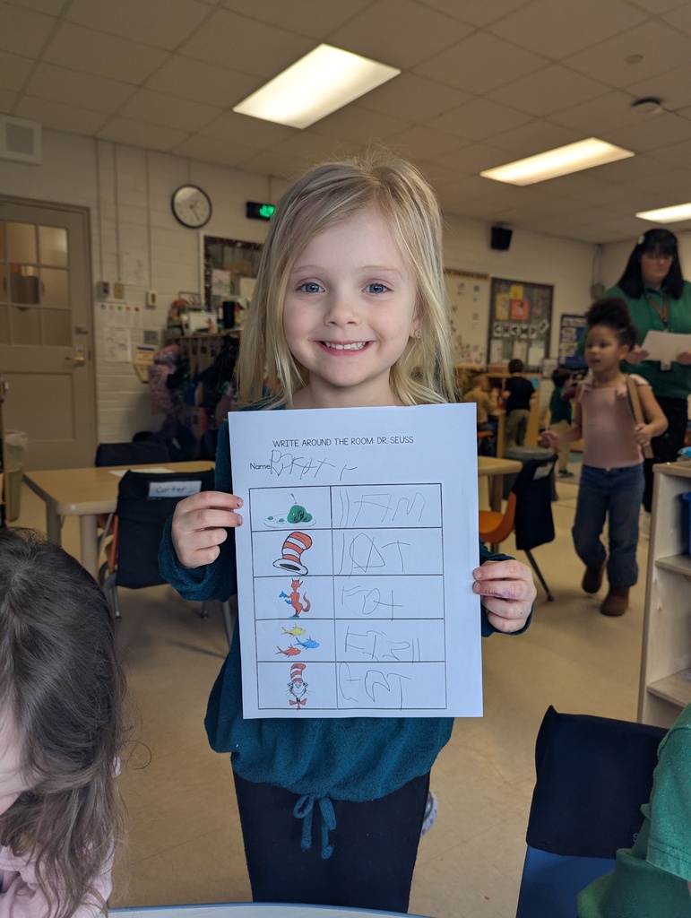 girl holding worksheet