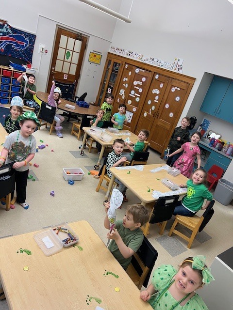students at tables engaged in an activity for st patricks day