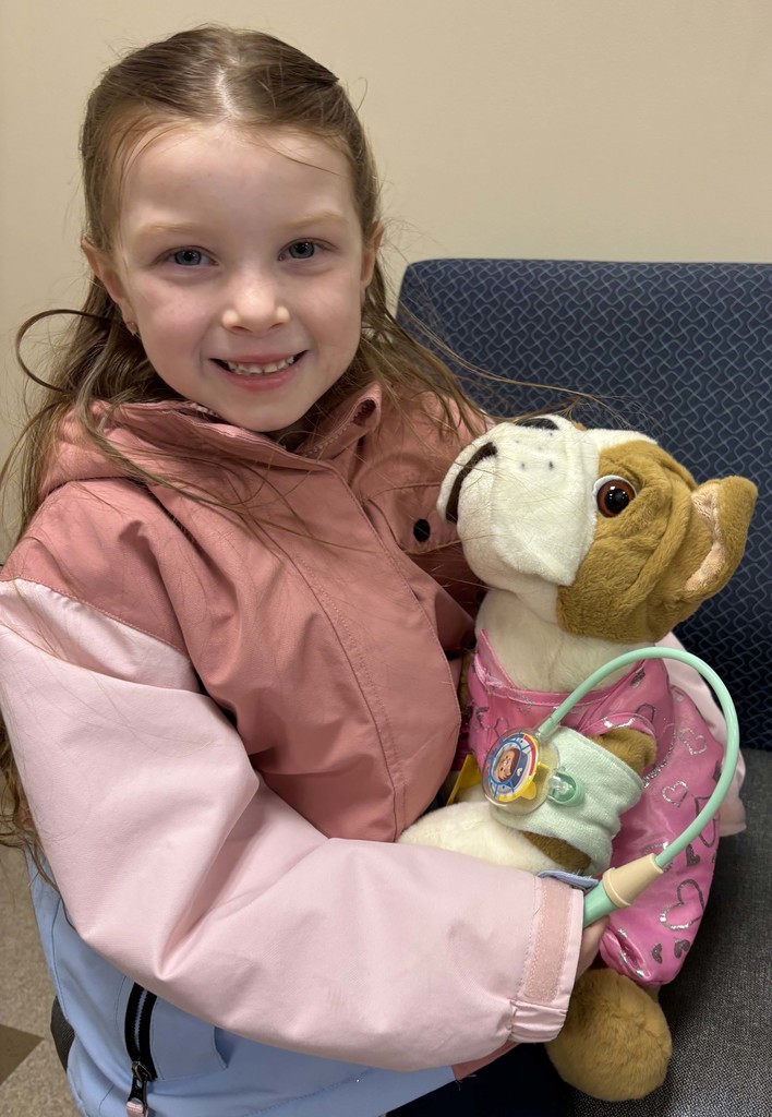 girl taking stuffed animal's blood pressure