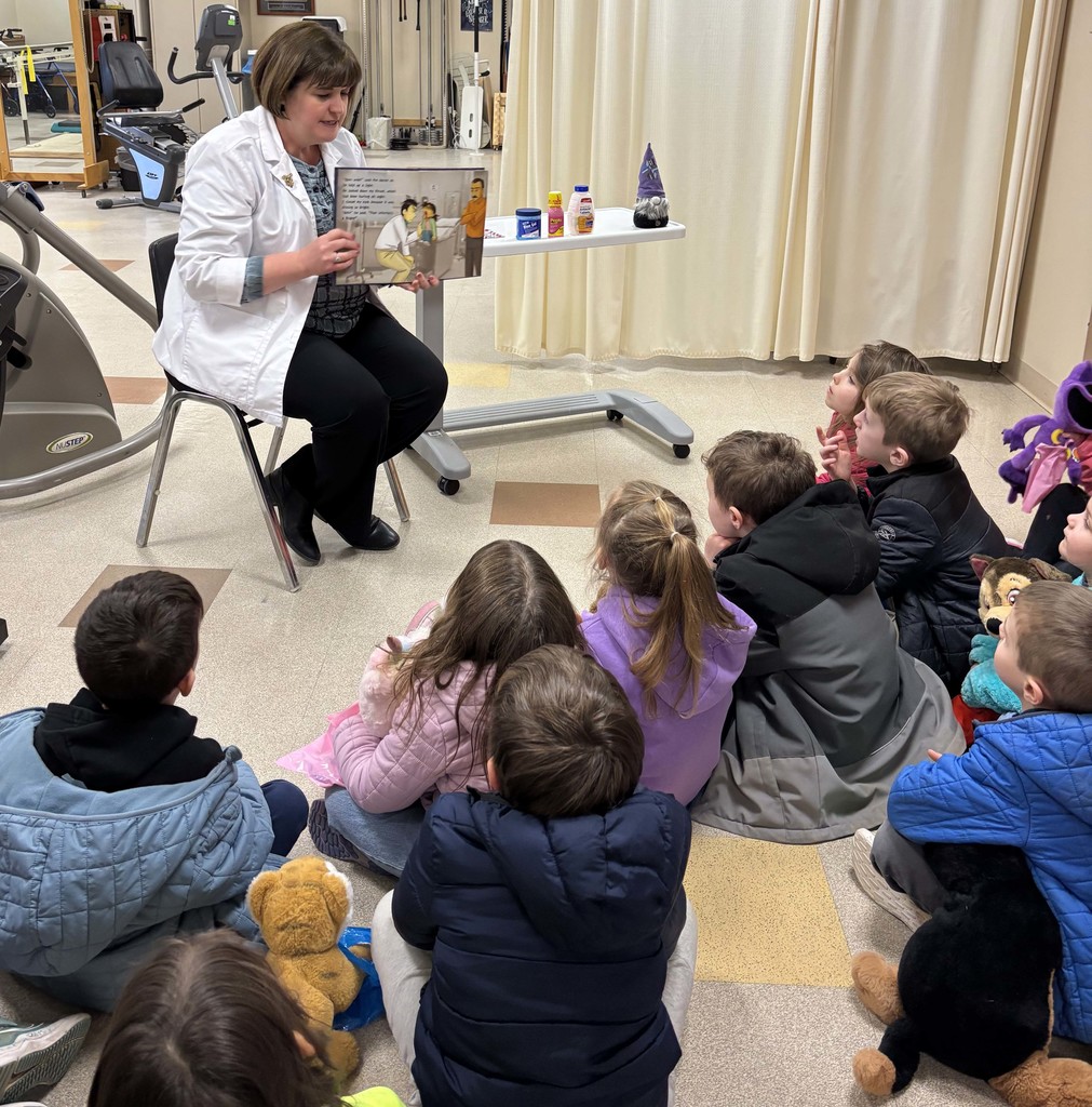 nurse showing students a picture