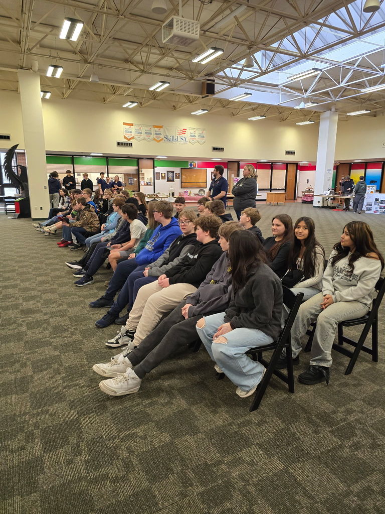 students sitting on chairs in a boces area