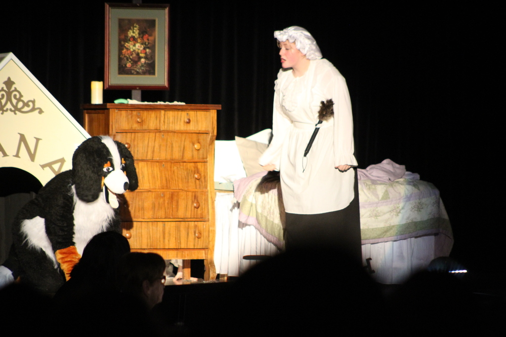 girl and student in costume on stage
