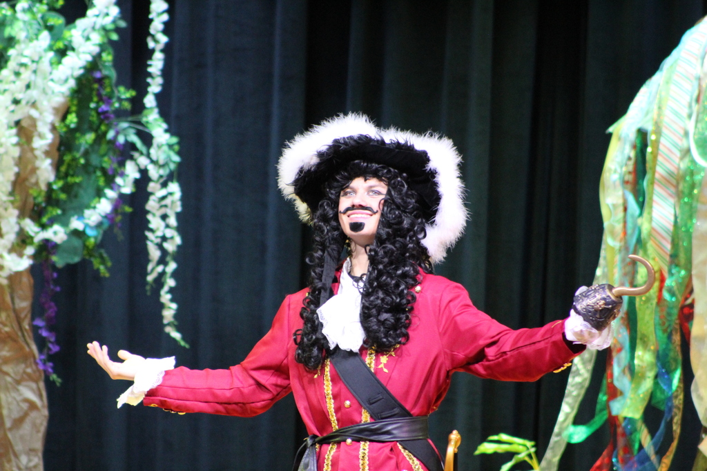 student in costume on stage