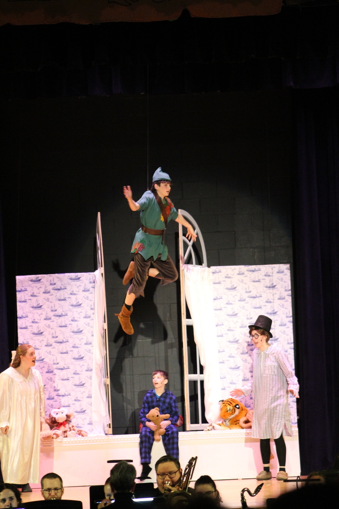 students acting on stage