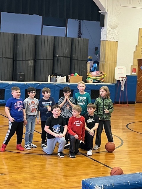 students in a group in the gym