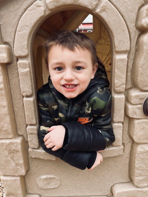 boy in house on playground