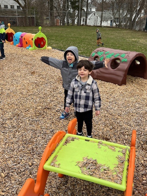 two boys playing on playground