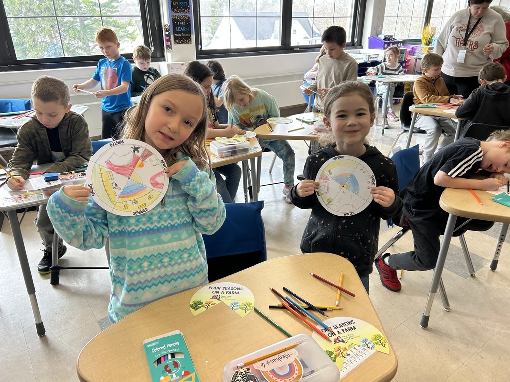 two girls showing their project