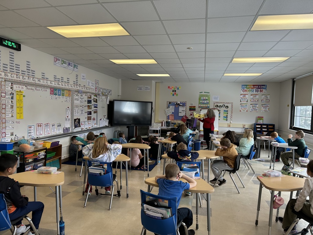students working at desks in classroom