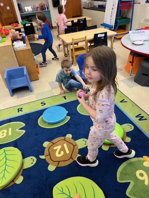 students playing together in classroom