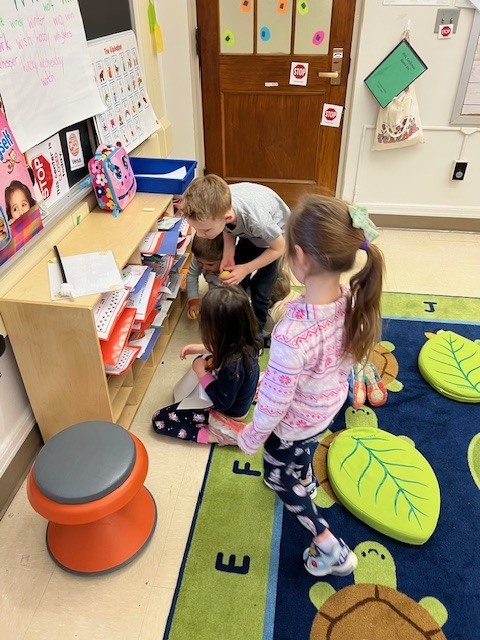 students playing together in classroom