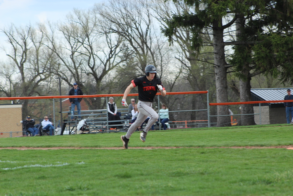 boy running to first base