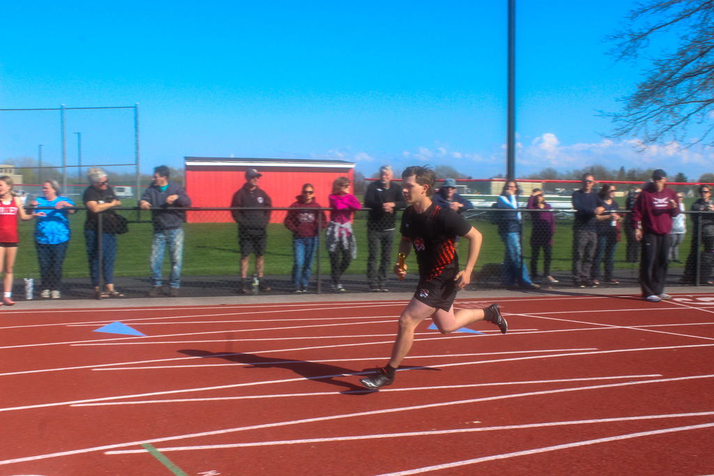 boy running with baton