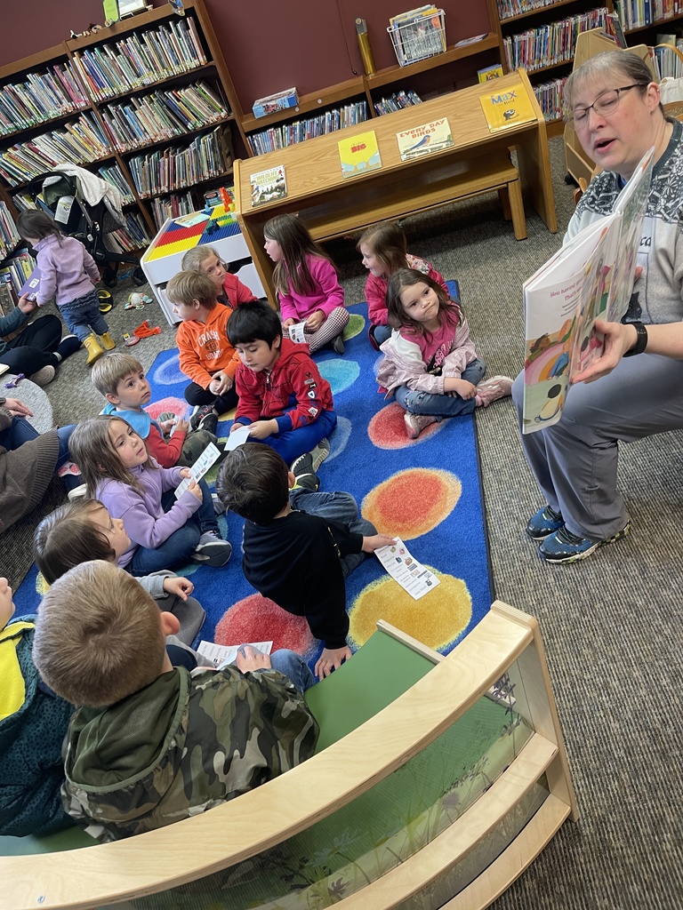 adult reading students a story