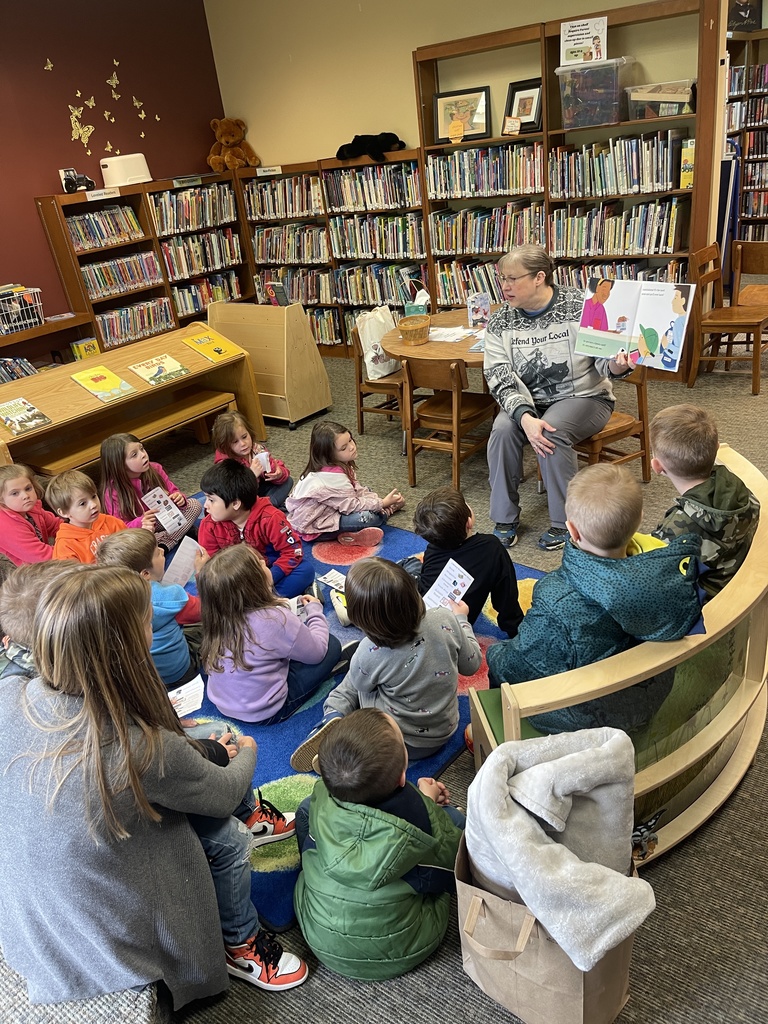 adult reading students a story