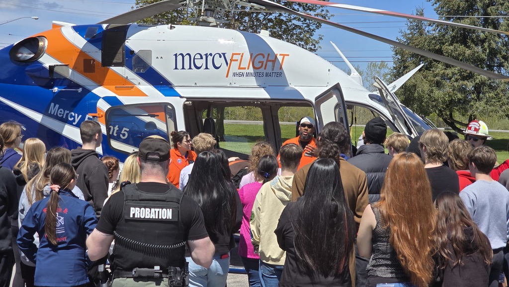 students listening to MercyFlight pilot speak