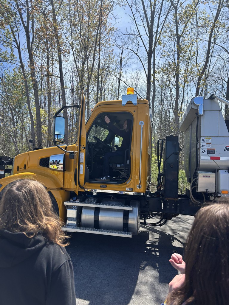 student in the cab of a truck