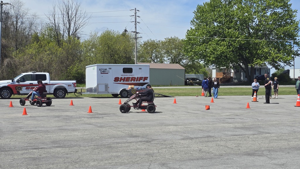 students driving pedal bikes wearing goggles