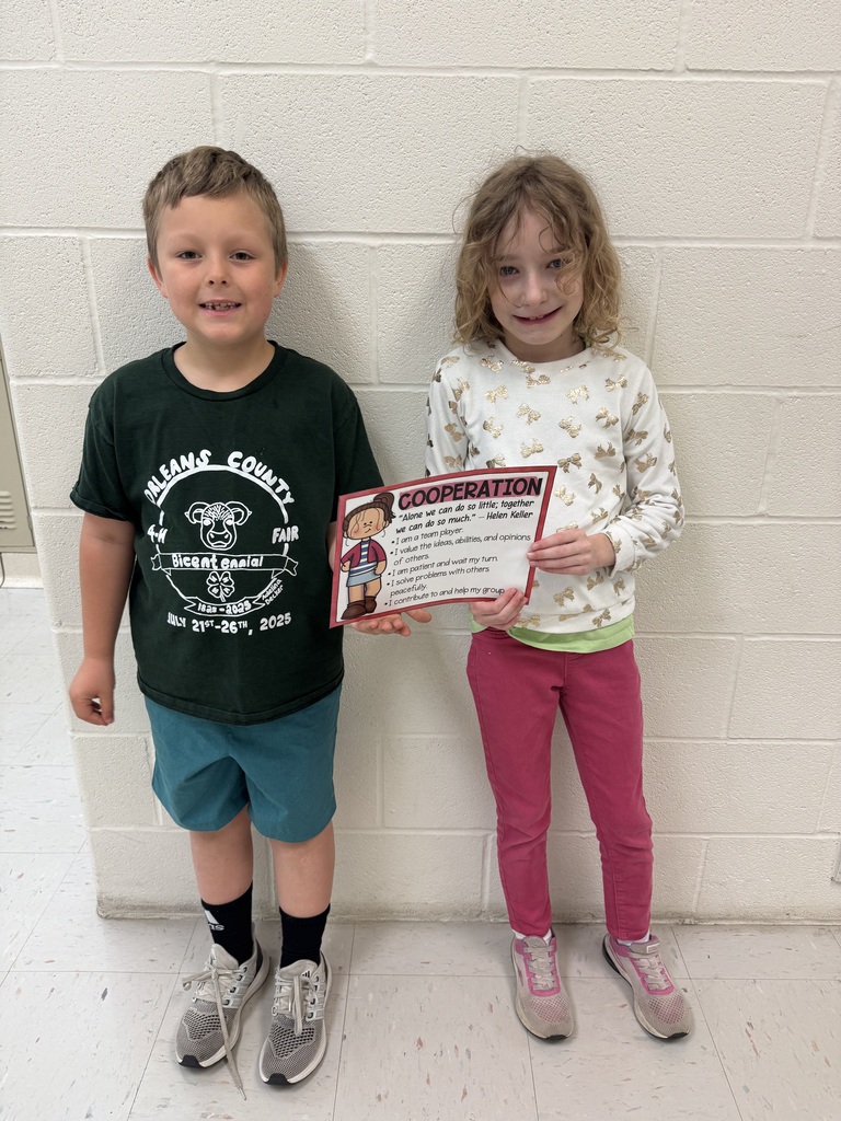 two students holding certificate