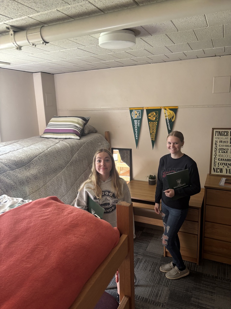 two students in a dorm room at a college