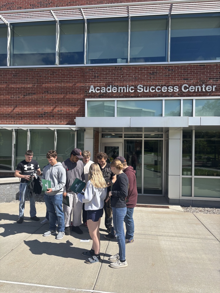 students outside academic success center on college campus
