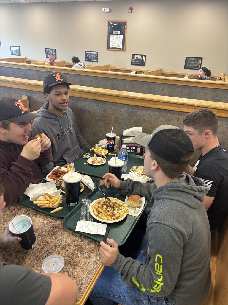 students eating at a table in restaurant