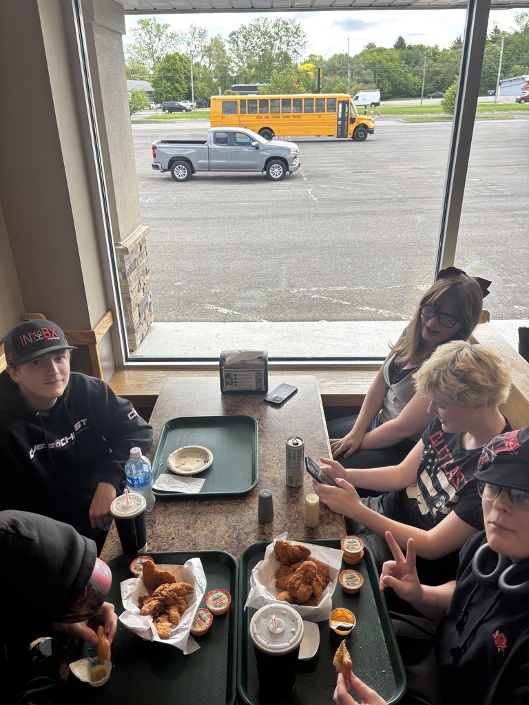 students eating at a table in restaurant