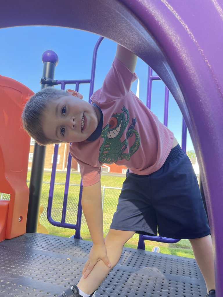 student on playground equipment